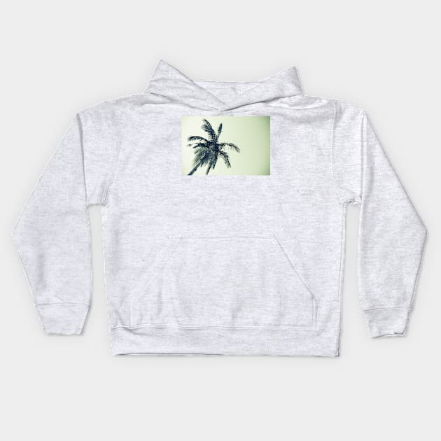 Palm tree against sky low angle point of view monochrome faded image. Kids Hoodie by brians101